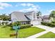 Charming two-story home with an attached two-car garage and beautifully maintained landscaping at 754 Birgham Pl, Lake Mary, FL 32746