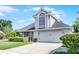 Charming two-story home featuring a two-car garage, manicured lawn, and an inviting entrance at 754 Birgham Pl, Lake Mary, FL 32746