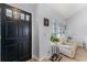 Bright and inviting entryway with hardwood floors, neutral walls, and a view of the living area at 754 Birgham Pl, Lake Mary, FL 32746