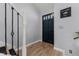 Welcoming foyer with hardwood floors, elegant staircase, and decorative wall art at 754 Birgham Pl, Lake Mary, FL 32746