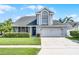 Charming two-story home with a well-manicured lawn, a two car garage, and beautiful curb appeal at 754 Birgham Pl, Lake Mary, FL 32746
