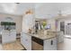Kitchen area featuring granite countertops, stainless steel appliances, and a view of the living room at 754 Birgham Pl, Lake Mary, FL 32746