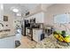 Well-equipped kitchen featuring stainless steel appliances, granite counters, and adjacent living spaces at 754 Birgham Pl, Lake Mary, FL 32746