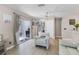 Cozy living area with sliding glass doors and an armchair at 754 Birgham Pl, Lake Mary, FL 32746