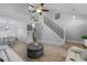 Spacious living room with wood flooring, stairs, and modern furniture at 754 Birgham Pl, Lake Mary, FL 32746