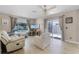 Bright living room with large window, sliding glass door, and pool view at 754 Birgham Pl, Lake Mary, FL 32746
