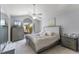 Inviting main bedroom featuring a large bed, carpet floors, and a large window at 754 Birgham Pl, Lake Mary, FL 32746