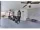 Relaxing covered patio area with multiple ceiling fans, comfortable seating, and a view of the screened pool at 754 Birgham Pl, Lake Mary, FL 32746