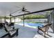 Inviting lanai area with a pool and plenty of seating with a ceiling fan for air circulation at 754 Birgham Pl, Lake Mary, FL 32746