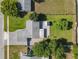 Aerial shot of the property, showcasing the layout, landscaping, and surrounding neighborhood at 7911 Murcott Cir, Orlando, FL 32835
