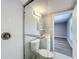 Updated bathroom featuring a glass shower door, white vanity, and new lighting at 7911 Murcott Cir, Orlando, FL 32835