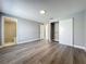 Bedroom featuring wood-look floors and closet with sliding doors at 7911 Murcott Cir, Orlando, FL 32835