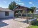 Cozy gazebo with brick pavers, perfect for outdoor gatherings and relaxation in a peaceful backyard setting at 7911 Murcott Cir, Orlando, FL 32835