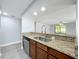 Bright kitchen showcasing granite counters, stainless steel appliances, and breakfast bar at 7911 Murcott Cir, Orlando, FL 32835