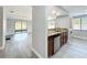 Open concept kitchen overlooking the living area, featuring granite countertops and stainless appliances at 7911 Murcott Cir, Orlando, FL 32835