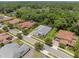 Overhead perspective highlights the home's well-kept lawn and charming neighborhood setting with mature landscaping at 8080 Peaceful Cir, Sanford, FL 32771