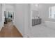Elegant bathroom with a soaking tub, double vanity, modern fixtures, and neutral color palette at 8080 Peaceful Cir, Sanford, FL 32771