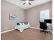 Bedroom featuring a daybed, desk, and ceiling fan at 8080 Peaceful Cir, Sanford, FL 32771