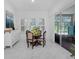 Charming breakfast nook bathed in natural light, with a modern table and chairs and sliding glass doors at 8080 Peaceful Cir, Sanford, FL 32771