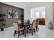 Dining room with tile floors, a dark wood table, and a view into the entry hall at 8080 Peaceful Cir, Sanford, FL 32771