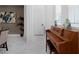 Hallway features a piano, modern art, and abundant natural light at 8080 Peaceful Cir, Sanford, FL 32771