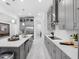 Spacious, modern kitchen featuring stainless steel appliances, sleek gray cabinetry, and a large center island at 8080 Peaceful Cir, Sanford, FL 32771