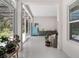Bright living space featuring large windows, tiled flooring, and access to outdoor views at 8080 Peaceful Cir, Sanford, FL 32771