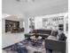 Spacious living area with gray sectional, modern kitchen, and an adjacent dining space at 8080 Peaceful Cir, Sanford, FL 32771