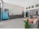 Open-concept living area boasts modern appliances, stylish furniture, and seamless access to outdoor living at 8080 Peaceful Cir, Sanford, FL 32771