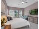 Spacious main bedroom with a TV, sofa, and white tile flooring at 8080 Peaceful Cir, Sanford, FL 32771