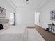 Bright main bedroom featuring a king-sized bed, and plush carpet at 8080 Peaceful Cir, Sanford, FL 32771