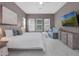 Spacious main bedroom with a TV, sofa, and white tile flooring at 8080 Peaceful Cir, Sanford, FL 32771