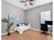 Cozy home office featuring a daybed, desk, and stylish decor at 8080 Peaceful Cir, Sanford, FL 32771