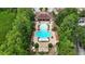Aerial view of community pool with lounge chairs and lush landscaping offering a luxurious resort-like experience at 8219 Roseville Blvd, Davenport, FL 33896