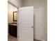 Powder room with a granite vanity and large mirror at 8219 Roseville Blvd, Davenport, FL 33896