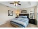 Cozy bedroom with a ceiling fan and a large window offering natural light at 8219 Roseville Blvd, Davenport, FL 33896