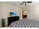 Large bedroom with ceiling fan, television and view of an additional room at 8219 Roseville Blvd, Davenport, FL 33896