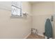 Walk-in closet with shelving and a small window at 8219 Roseville Blvd, Davenport, FL 33896