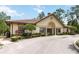 Exterior of community clubhouse with well-manicured landscaping and ample parking at 8219 Roseville Blvd, Davenport, FL 33896