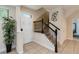 Welcoming entryway with staircase, tiled flooring, and natural light at 8219 Roseville Blvd, Davenport, FL 33896