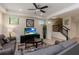 Comfortable living room with tile floors, gray couches, staircase, and natural light at 8219 Roseville Blvd, Davenport, FL 33896
