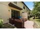 Private brick-paved patio featuring comfortable outdoor seating for relaxing and enjoying the outdoors at 8219 Roseville Blvd, Davenport, FL 33896