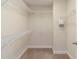 Spacious walk-in closet with ample shelving for organization and storage at 8219 Roseville Blvd, Davenport, FL 33896