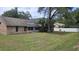 Backyard featuring lawn and brick exterior at 900 Red Fox Rd, Altamonte Springs, FL 32714