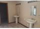 Dual sinks and tiled floors in this well-lit, neutral-toned primary bathroom at 900 Red Fox Rd, Altamonte Springs, FL 32714