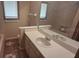 Bathroom featuring a bathtub, sink, and large mirror at 900 Red Fox Rd, Altamonte Springs, FL 32714