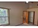 Bedroom with open closet and window at 900 Red Fox Rd, Altamonte Springs, FL 32714