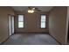 Sunny bedroom with neutral carpeting, sliding glass door access, and ample natural light at 900 Red Fox Rd, Altamonte Springs, FL 32714