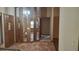 Open entryway with tile flooring, unique lighting fixtures, and a view into the living spaces at 900 Red Fox Rd, Altamonte Springs, FL 32714