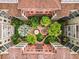 Overhead view of tropical landscaping in community courtyard, with buildings surrounding the grounds at 911 N Orange Ave # 335, Orlando, FL 32801